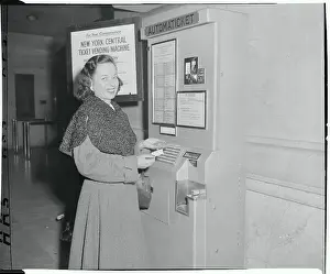 Woman Using a Ticket Vending Machine
