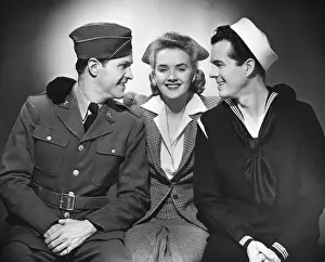 Woman w / two military men
