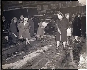 Melting Prints: Woman Walking Through Slushy Street