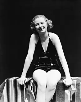 Suit Prints: Woman wearing black satin bathing suit