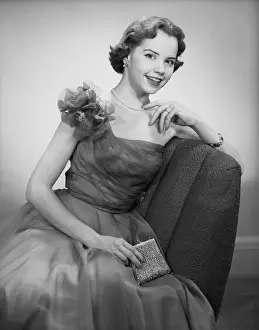 Purse Prints: Woman wearing dress sitting in chair, portrait