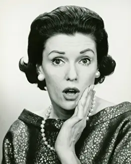Woman wearing expression of surprise, (B&W), (Portrait)