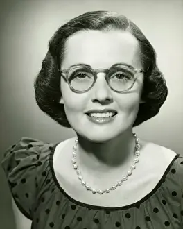 Polka Dot Prints: Woman wearing glasses posing in studio, (B&W), (Close-up), (Portrait)