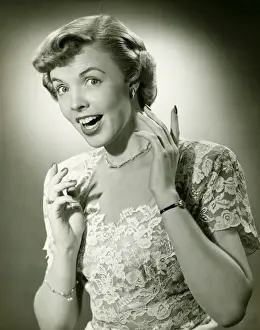 1950s Style Prints: Woman wearing lace dress gesturing in studio, (B&W), (Close-up), (Portrait)