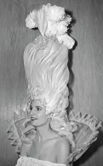 Exaggeration Prints: Woman Wearing Towering Hairstyle