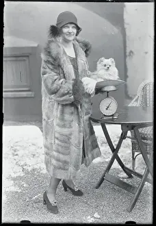 Woman Weighing Her Dog