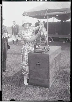 Caring Prints: Woman Weighing Her Dog