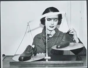 Up And Down Prints: Woman Weighing Shoes on Scale