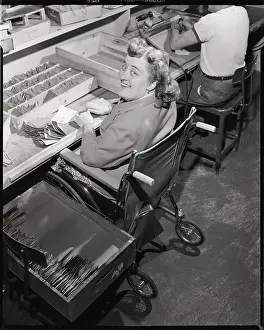 Disabled Prints: Woman in Wheelchair Looks Up from Work