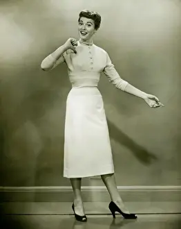 Making A Face Prints: Woman in white dress pointing to herself in studio, (B&W), portrait