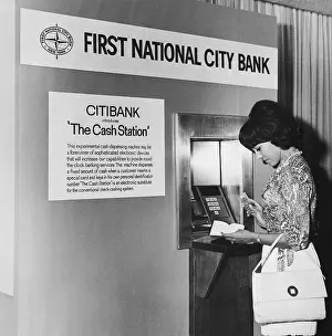 Woman Withdrawing Money from Cash Station