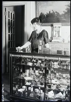 Counter Prints: Woman Working At Perfume Counter