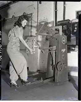 Woman Working At Welding Machine