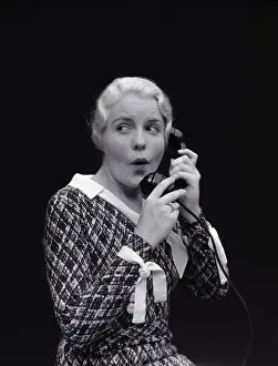 Worried Prints: Woman with worried expression, on telephone. (Photo by H