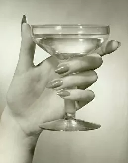 Images Dated 28th February 2008: Womans hand holding martini, close-up