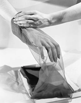 Steep Collection: Womans hand inside silk stocking