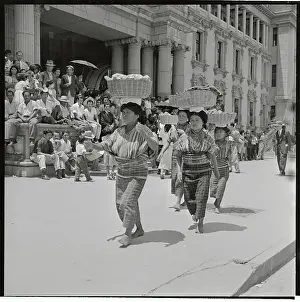 Women Carrying Baskets on Their Heads