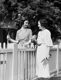 Images Dated 17th April 2016: Women chatting over fence