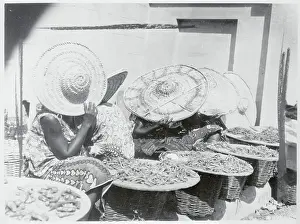 Women Covering Faces with Hats