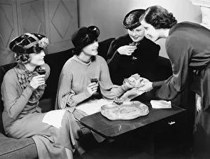 Visit Collection: Four women drinking wine, talking in living room (B&W)