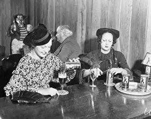 Two Women Enjoying Beer Together