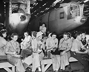 Women Factory Workers Eat Lunch; Plane