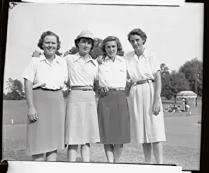 Four Women Golfers on Course