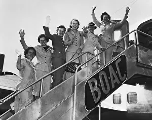 Women Golfers Waving from Airplane Staircase