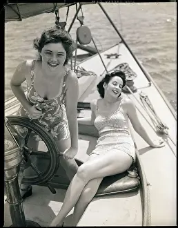 Women at the Helm of Sailboat