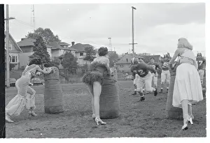 Women Helping a Football Team With Tackling Practice
