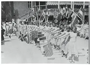 Women Holding Flags of Various Countries