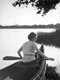 Paddle Prints: Women Holds Paddle While In Canoe