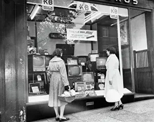 Storefront Prints: Women Looking at Televisions in Store Window