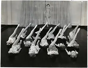 Class Prints: Women Lying In Rows Doing Leg Lifts