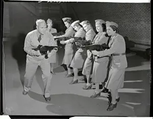 Women in Military Training with Weapons