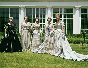 Women Modeling Gowns on Lawn