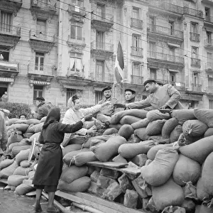 Women Pass Food over Barrier to Guards