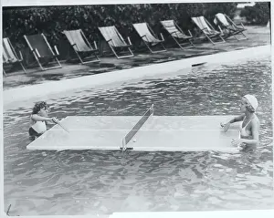 Women Playing Ping Pong in Pool