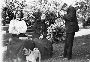 Women Pose On Bench For Boy W/Camera