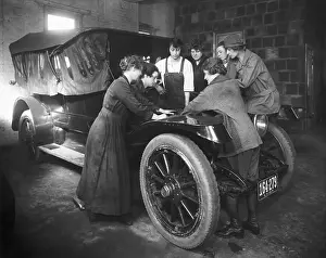 Class Prints: Women Receive Instruction Working On Car