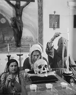 Worshiping Prints: Women of Red Hoods Pray Before Skull