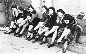 Women Removing Their Silk Stockings