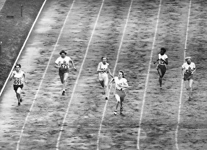 Women Running at End of 100 M Dash