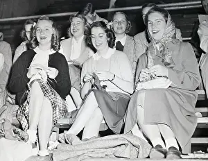 Women Seated in Stands Knitting