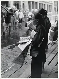 Women Selling Newspapers On Sidewalk