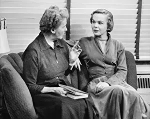 Listening Prints: Two women sitting on couch, talking, (B&W)