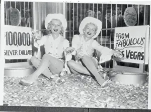 Women Sitting on Silver Dollars