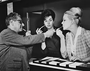 Women Smoking Pipes With a Man