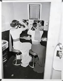 Grooming Prints: Two Women Styling Their Hair