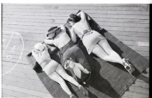 Three Women Sunbathing